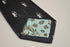 navy blue tie with archer silhouette design